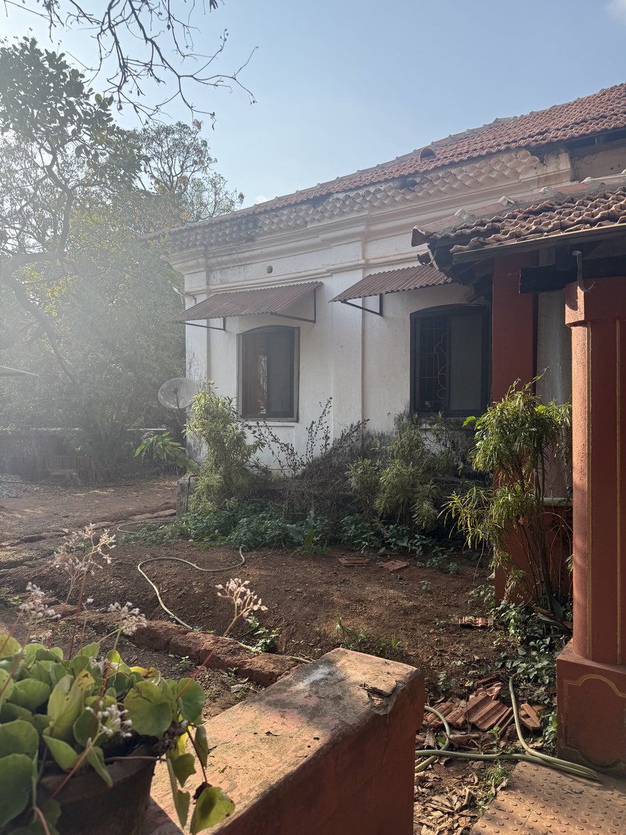 Traditional cottage exterior with sun haze